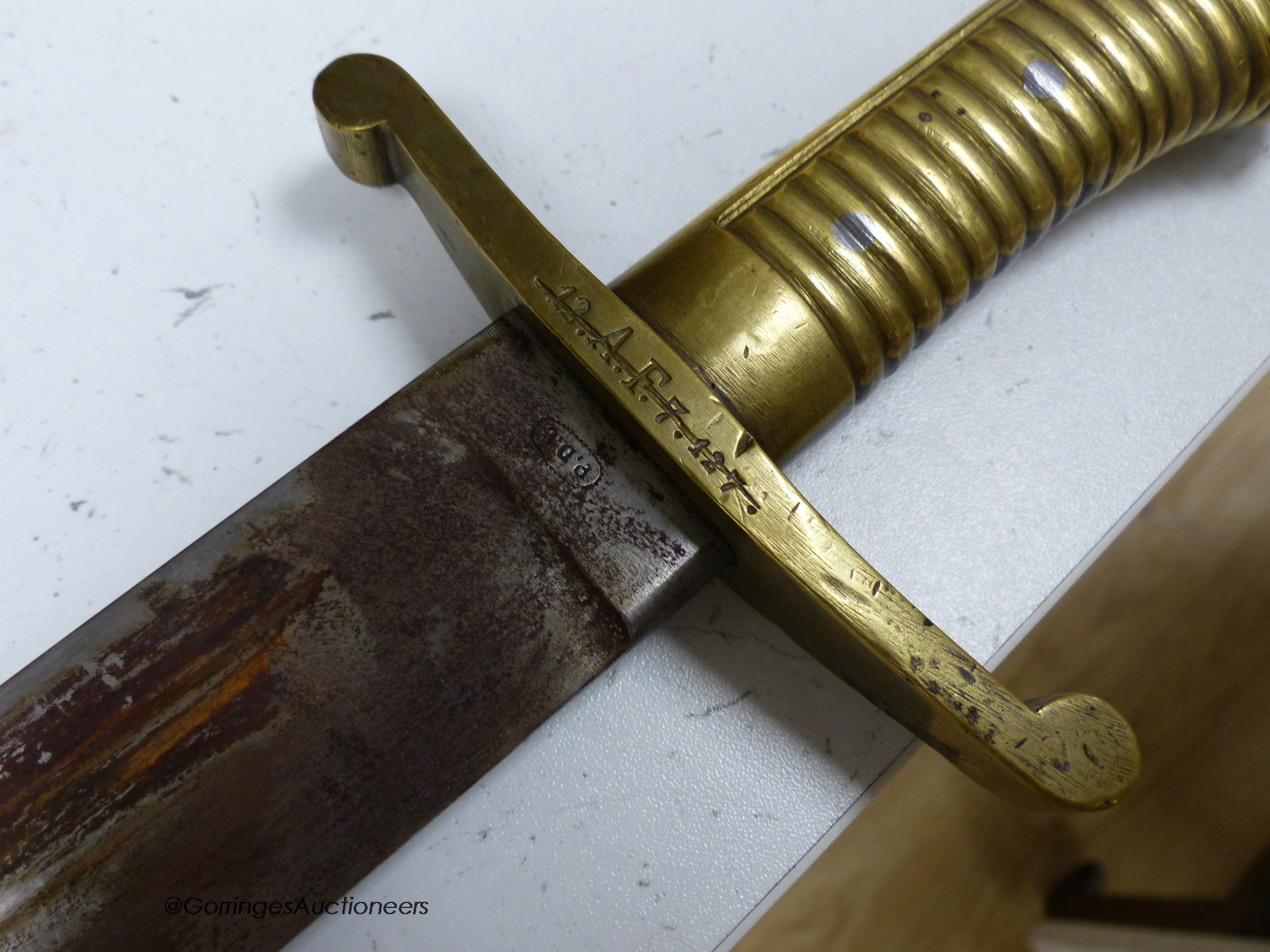 A French short sword and sheath, both marked 12.A.F.7.127